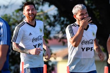 Argentina's Lionel Messi (L) and Argentina's Sergio Aguero laugh as they train during a practice session in Belo Horizonte, Brazil, on July 1, 2019, on the eve of the Copa America tournament semi-final football match between Argentina and Brazil. / AFP / PEDRO UGARTE