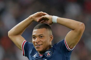 PSG's Kylian Mbappe celebrates after scoring his third goal during the French League One soccer match between Paris Saint Germain and Metz at the Parc des Princes stadium in Paris, France, Saturday, May 21, 2022.  (AP Photo / Michel Spingler)