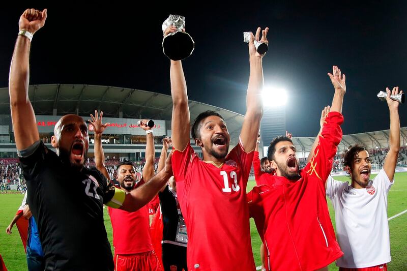 Bahrain players celebrate with the trophy. EPA