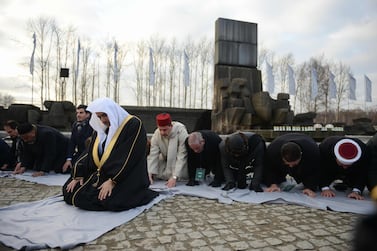 Sheikh Mohammad Abdulkarim Al Issa, secretary general of the Muslim World League, leads prayers next to the memorial monument in the former German Nazi death camp Auschwitz-Birkenau on January 23, 2020. The visit takes place as part of events commemorating 75 years since the liberation of Auschwitz, the World War II death camp where the Nazis killed more than 1.1 million people, most of them Jews AFP