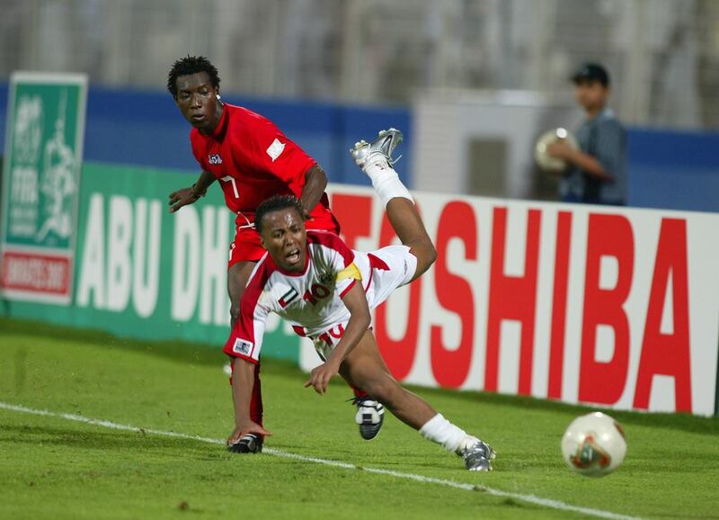 Emirati Ismail Matar fights for the ball with Amadou Coulibaly of Burkina Faso during their 2003 Fifa World Youth Championship group match in Abu Dhabi. Karim Jaafar/ AFP / December 4, 2003
