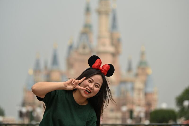 A woman without a face mask at Disneyland Shanghai. AFP