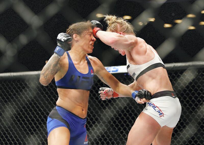 NEW YORK, NY - FEBRUARY 11: (L-R) Holly Holm of United States lands a punch against Germaine de Randamie in their UFC women's featherweight championship bout during UFC 208 at the Barclays Center on February 11, 2017 in the Brooklyn Borough of New York City.   Anthony Geathers/Getty Images/AFP