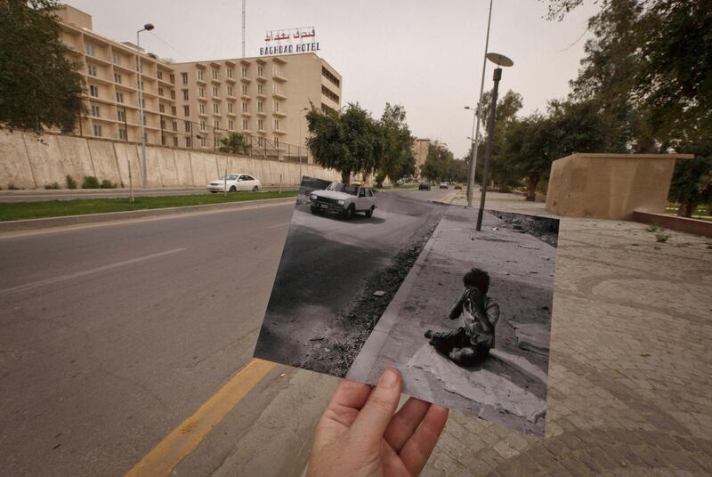 This Tuesday, March 12, 2013 photo shows a general view of Abu Nawas Street in Baghdad, Iraq, at the site of a photograph of Iraqi orphan Fady al-Sadik waking on the street, taken by photographer Maya Alleruzzo in April, 2003. The park that runs along Abu Nawas Street, named for an Arabic poet, is now a popular destination for families who are drawn by the manicured gardens, playgrounds and restaurants famous for a fish called mazgouf. Ten years ago, the park was home to a tribe of children orphaned by the war and was rife with crime. (AP Photo/Maya Alleruzzo) *** Local Caption ***  APTOPIX Mideast Iraq On This Site.JPEG-0c5e8.jpg