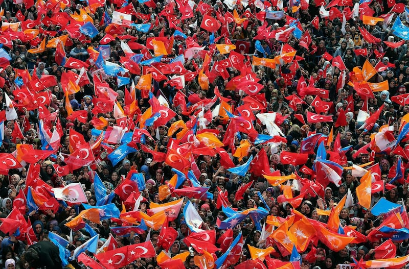Supporters of Turkey's President Recep Tayyip Erdogan's ruling Justice and Development Party (AKP) listen to his speech at a rally in Gaziantep, southeastern Turkey. AP