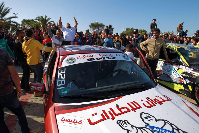 Spectators cheer a Libyan driver at a drifting competition meeting in the coastal city of Benghazi, Libya. AFP