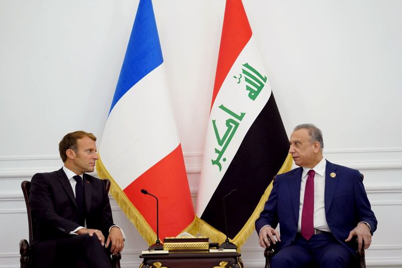 Iraqi Prime Minister Mustafa Al Kadhimi meets Mr Macron ahead of the summit. Iraqi Prime Minister Media Office / Reuters