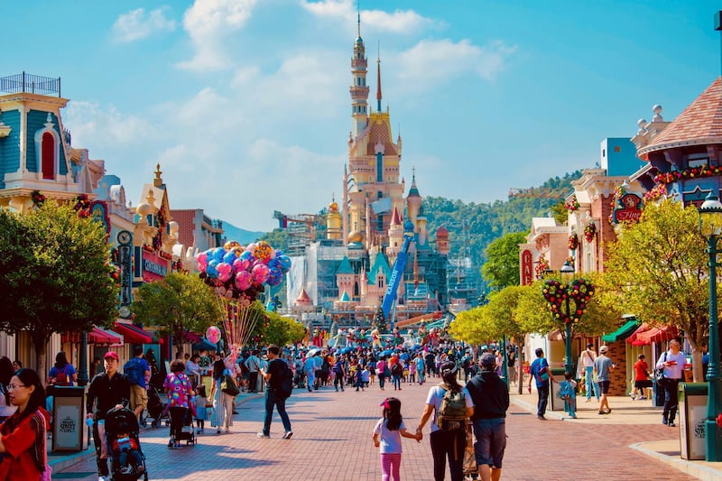 Visitors walk down Main Street, USA, at Hong Kong Disneyland, before the coronavirus pandemic. Unsplash 