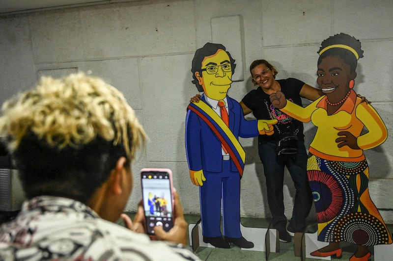 Ay, caramba! Supporters with Simpsons-style cartoon cutouts of the winners. AFP