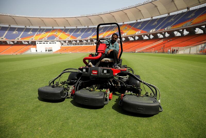 A groundsman works on the outfield at Narendra Modi Stadium in Ahmedabad, Gujarat. Reuters