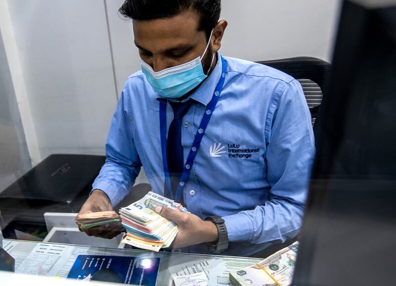 Family remittances from the UAE are strong, with an increase forecast for transfers to India and the South Asia region. Victor Besa / The National