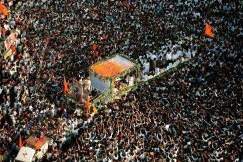 An estimated two million people lined the streets of Mumbai to catch a glimpse of the glass coffin carrying the body of Balasaheb Thackeray, the founder of Shiv Sena party who died yesterday.