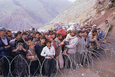 Thousands of Kurds flee Saddam Hussein's bloody suppression of a 1991 uprising in northern Iraq. They are gathered at a closed border in Doab, Iran, in search of sanctuary. Photo: Getty