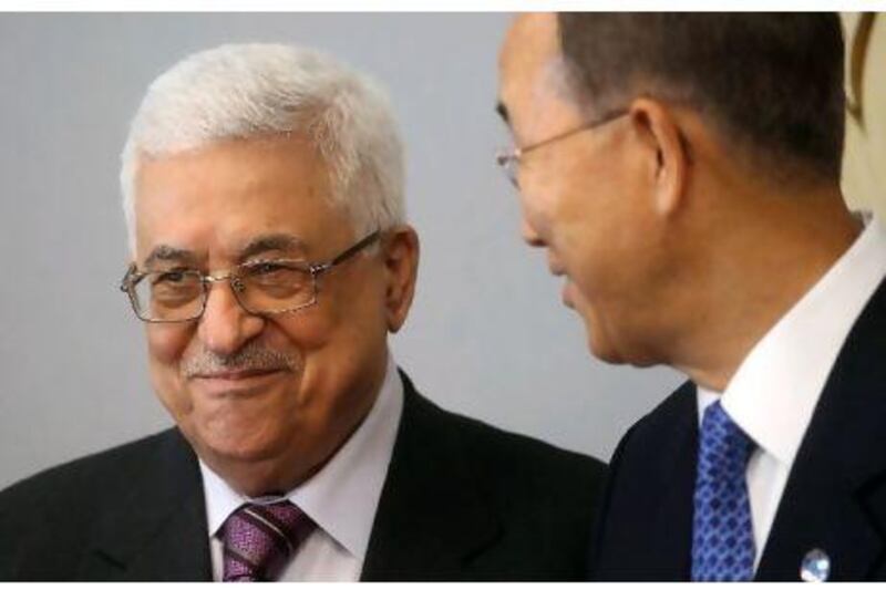 Palestinian President Mahmoud Abbas is greeted by the United Nations Secretary-General Ban Ki-moon at UN headquarters in New York yesterday. Mario Tama / Getty Images / AFP