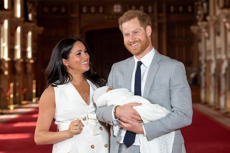 Britain's Prince Harry and Meghan, Duchess of Sussex hold their baby son Archie during a photocall in St George's Hall at Windsor Castle, in Berkshire, Britain May 8, 2019. Reuters