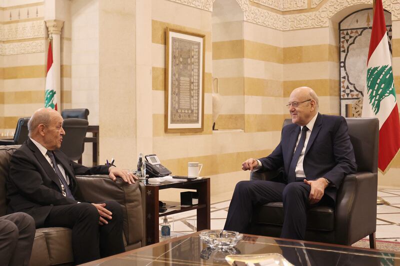 Lebanon's caretaker Prime Minister Najib Mikati (right) meets with French envoy Jean-Yves Le Drian in Beirut on November 29.  AFP