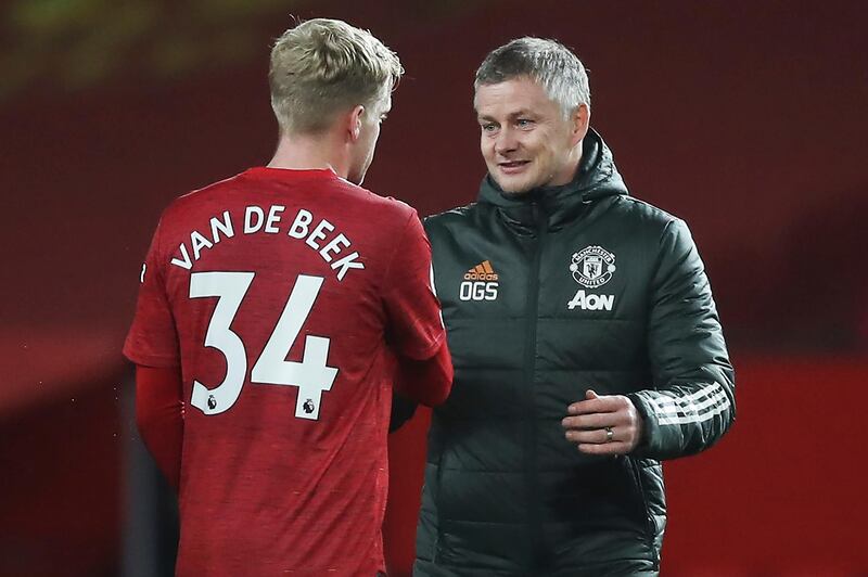 Manchester United manager Ole Gunnar Solskjaer, right, and Donny van der Beek celebrate after the win. AP