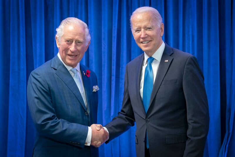 King Charles III, who was Prince of Wales at the time, greets US President Joe Biden at the Cop26 summit in Glasgow in 2021. AP