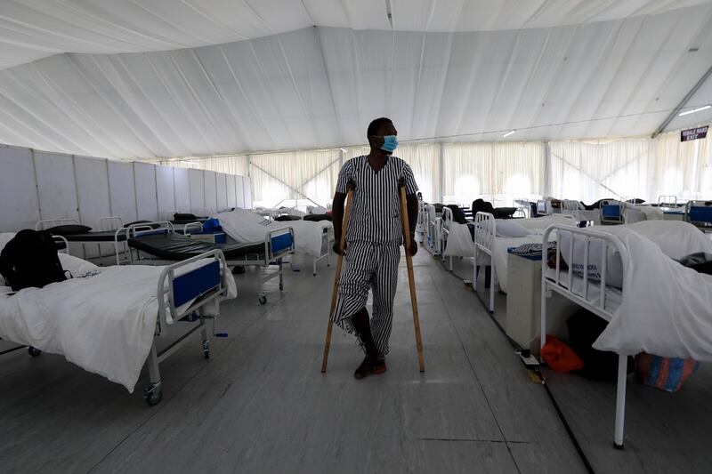 A man walks into an isolation ward to collect his belongings after recovering from Covid-19 in Machakos, Kenya. EPA