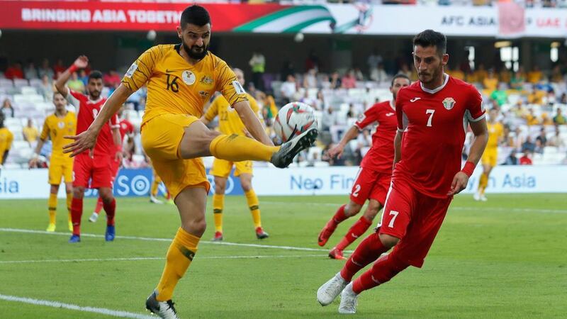 Australia defender Aziz Behich, left, is one of many Socceroo players from an immigrant community. Hassan Ammar / AP Photo