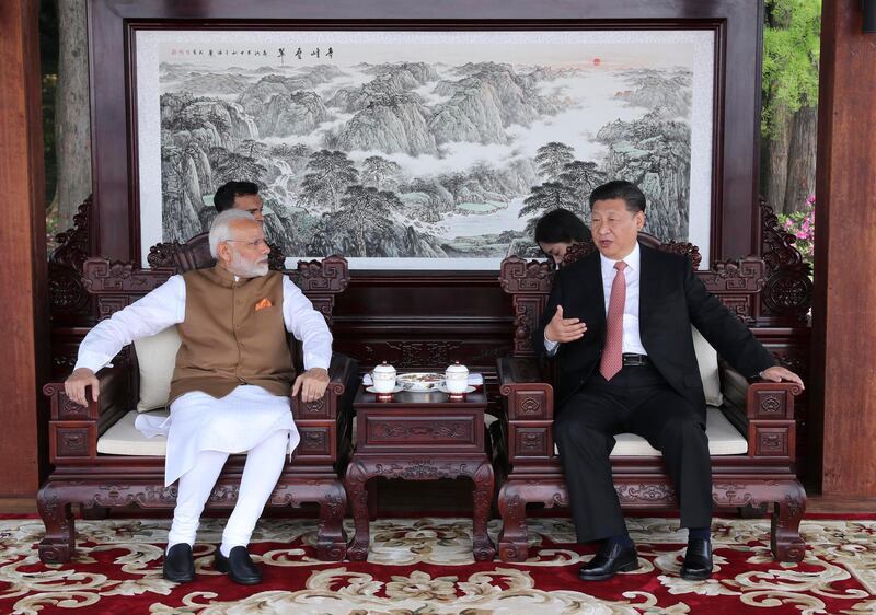 In this photo released by China's Xinhua News Agency, Indian Prime Minister Narendra Modi, left, and Chinese President Xi Jinping talk during a meeting in Wuhan in central China's Hubei Province, Saturday, April 28, 2018. The leaders of China and India stressed the importance of close ties in talks Saturday, against the background of their rivalry for leadership in Asia and the potential for cooperation on economic and security matters. (Pang Xinglei/Xinhua via AP)