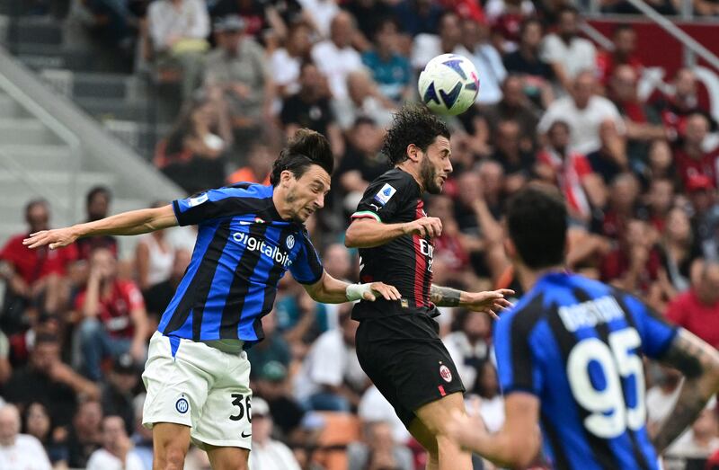 Inter Milan defender Matteo Darmian competes for a header with AC Milan defender Davide Calabria. AFP