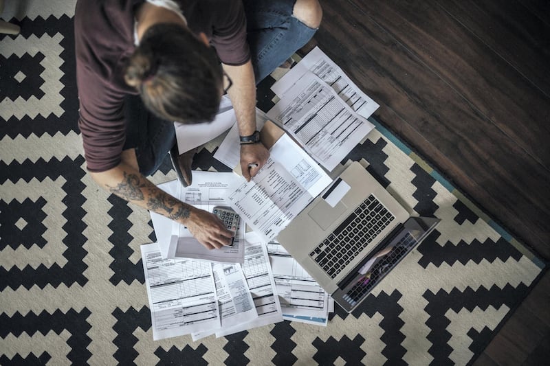 Person with man bun has a planty bills to pay.