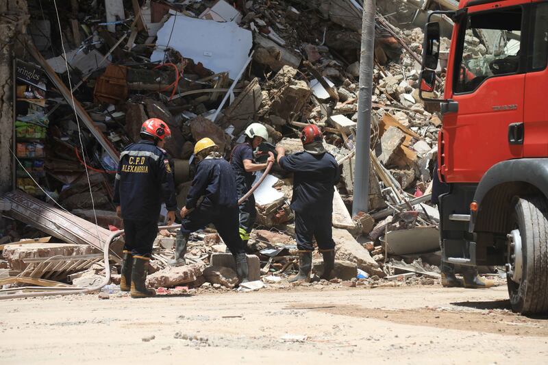 Searching for survivors amid the rubble. EPA