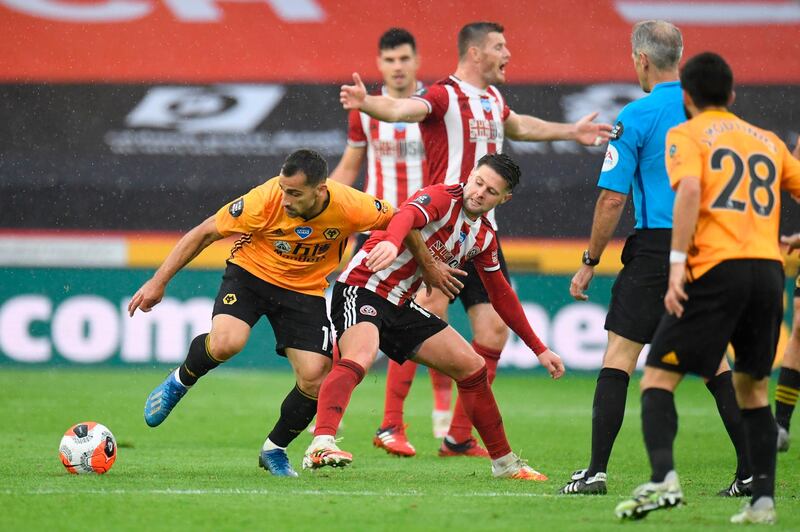 Wolverhampton Wanderers'Jonny Otto, left, vies with Sheffield United's Oliver Norwood. AFP