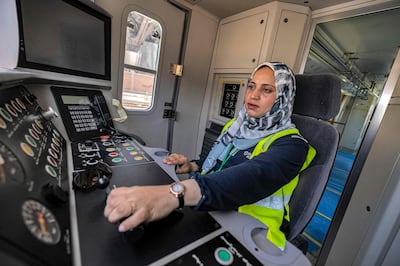 Hind Omar pilots a train simulator at Adly Mansour station in Cairo's suburb of Heliopolis in May. AFP