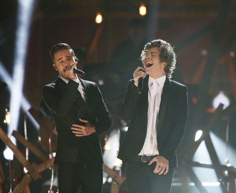 Liam Payne, left, and  Harry Styles of One Direction perform ‘Story of My Life’ at the 41st American Music Awards in Los Angeles, California. Lucy Nicholson / Reuters