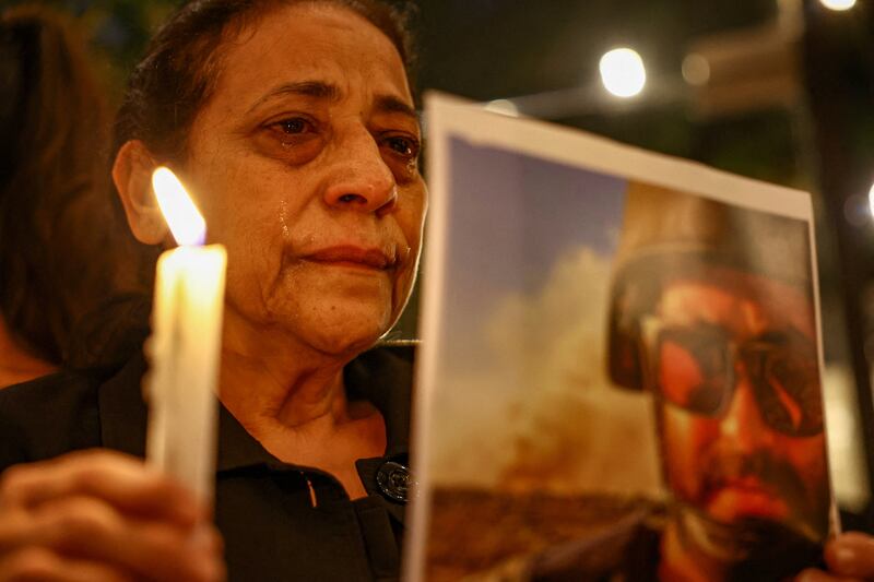 An aunt of Issam Abdallah, the Reuters video journalist who was killed in southern Lebanon while filming an Israeli tank firing into Lebanon, during a candlelight vigil in his name in Beirut, Lebanon, on October 20, 2023. Reuters