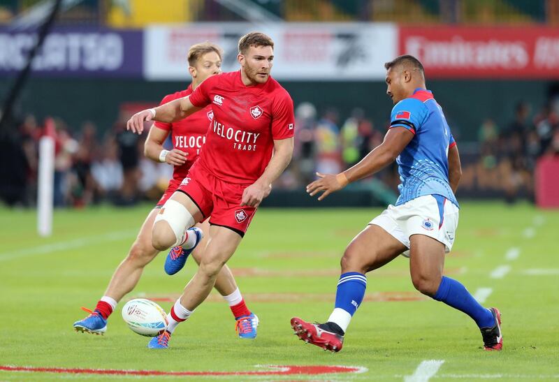 Dubai, United Arab Emirates - December 05, 2019: Isaac Kaay of Canada takes on defence of Samoa during the game between Samoa and Canada in the mens section of the HSBC rugby sevens series 2020. Thursday, December 5th, 2019. The Sevens, Dubai. Chris Whiteoak / The National