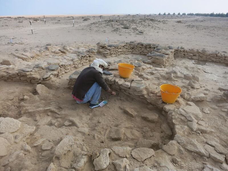 Abdulla Al Kaabi (Coastal heritage archaeologist at TCA Abu Dhabi) excavates inside Room 2 at site MR11, Marawah Island. Image Courtesy Abu Dhabi TCA *** Local Caption ***  Abdulla-Al-Kaabi-excavates-Room2-MR11.JPG