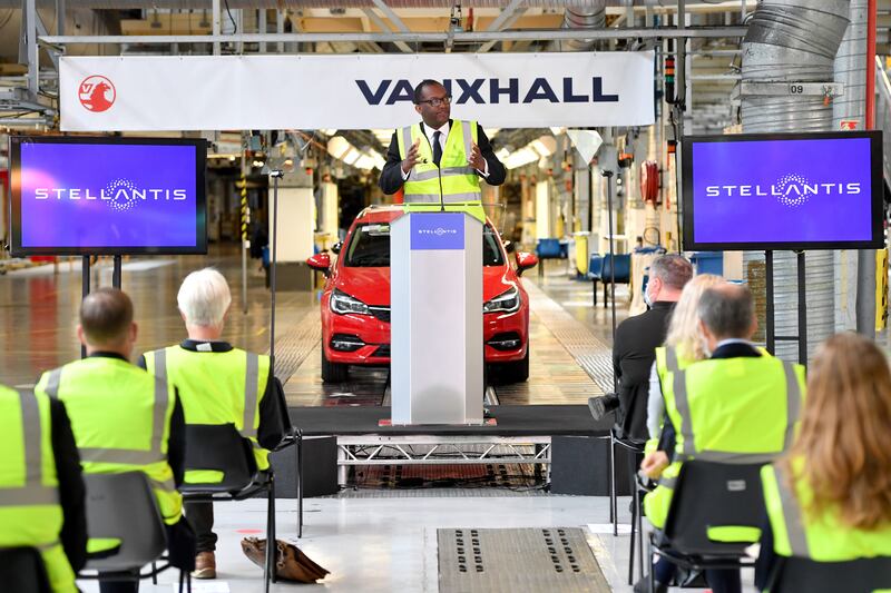 Mr Kwarteng speaks at the press conference announcing Stellantis' investment in the Vauxhall Ellesmere Port plant to build new electric vehicles, in July 2021. Getty Images