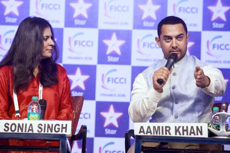 Bollywood superstar Aamir Khan and Sonia Singh, editorial Director of NDTV, attend the FICCI Frames 2015 conference at Hotel Renaissance. Subhash Sharma for The National
