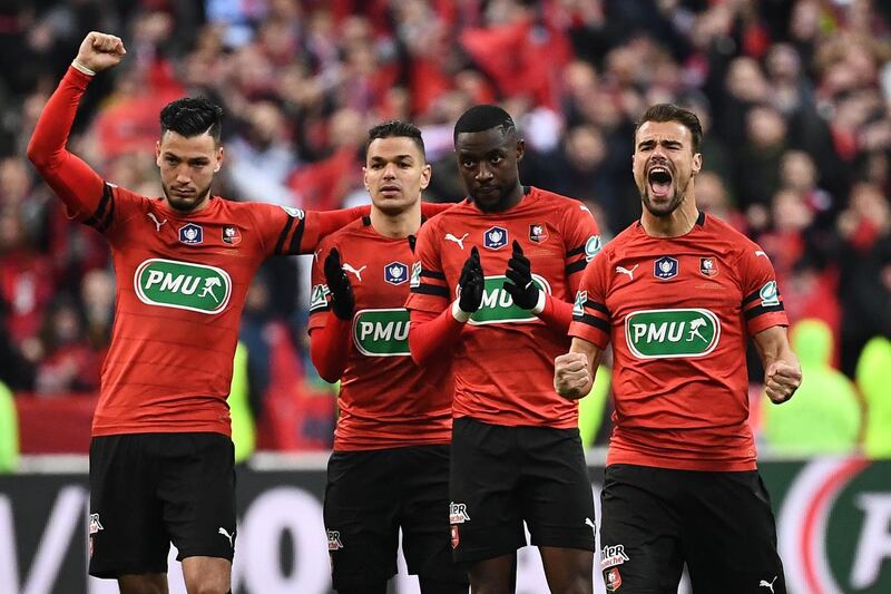 Rennes players react during the penalty shootout. Anne-Christine Poujoulat / AFP