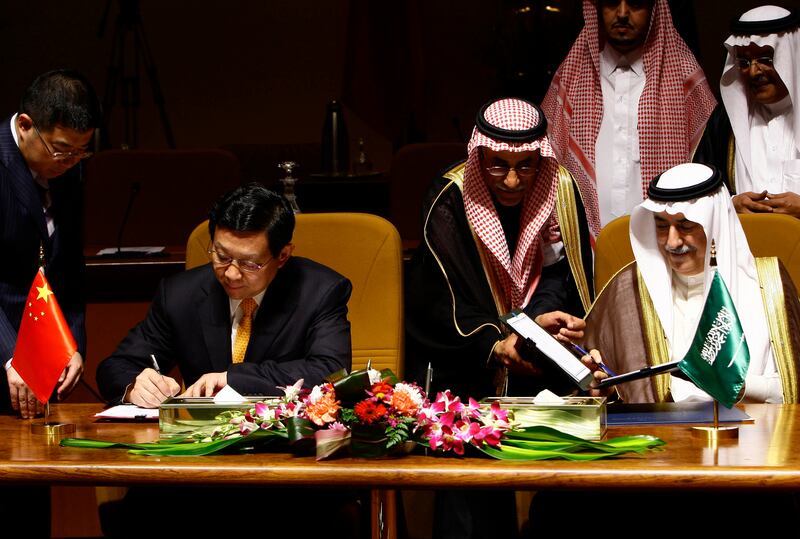 Saudi Finance Minister Ibrahim Al Assaf, right, and Chinese Minister of Commerce Chen Deming sign an agreement in Riyadh in January 2010.