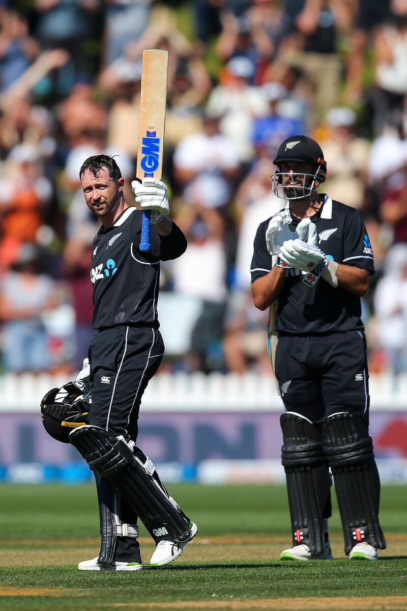 Devon Conway of New Zealand celebrates his century while Daryl Mitchell looks on at the Basin Reserve. Getty