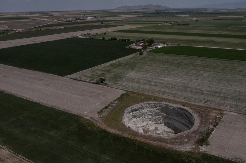An aerial shot of a giant sinkhole in Karapinar farmland. Farmers extracting groundwater have caused the water table to drop by two metres.