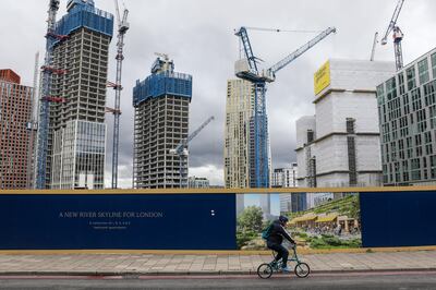 A cyclist passes construction work at the One Thames City development in London. Getty Images