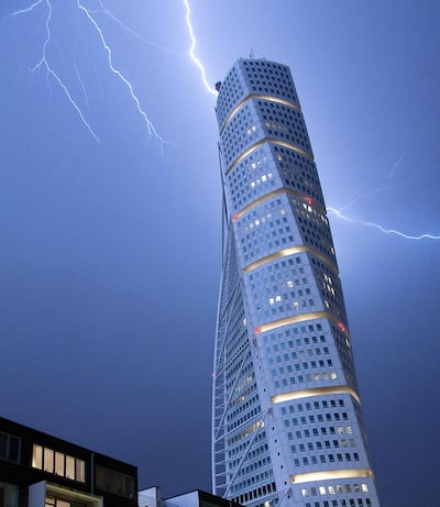 Lightning strikes the 190 m (623 ft)-high Turning Torso building in Malmo early morning on June 7, 2011. As the unseasonally hot weather was replaced by cooler winds, heavy rain and thunderstorms struck Sweden's South-west coast. AFP PHOTO / SCANPIX - JOHAN NILSSON (Photo by JOHAN NILSSON / SCANPIX SWEDEN / AFP)