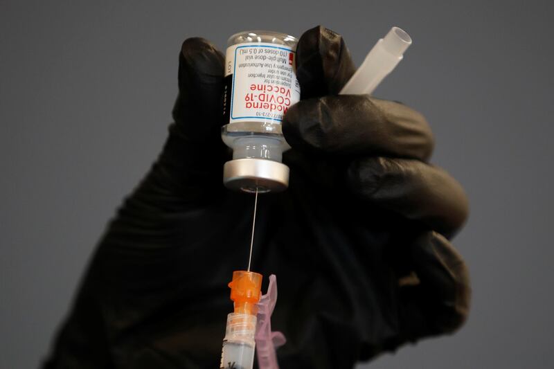 A health care worker fills a syringe with the Moderna vaccine as California opens up vaccine eligibility to any residents 16 years and older in Chula Vista, California, US. Reuters
