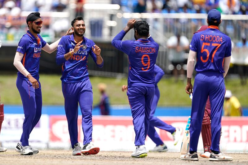 India's Axar Patel, second from left, celebrates after West Indies' Nicolas Pooran is run out during the fourth T20. AP
