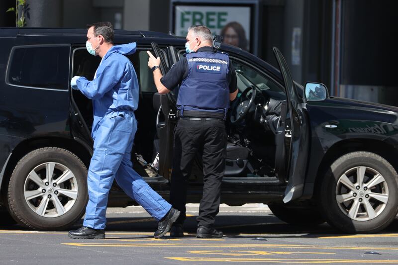 Police forensic staff gather evidence from the Lynn Mall car park in Auckland, New Zealand. Getty Images