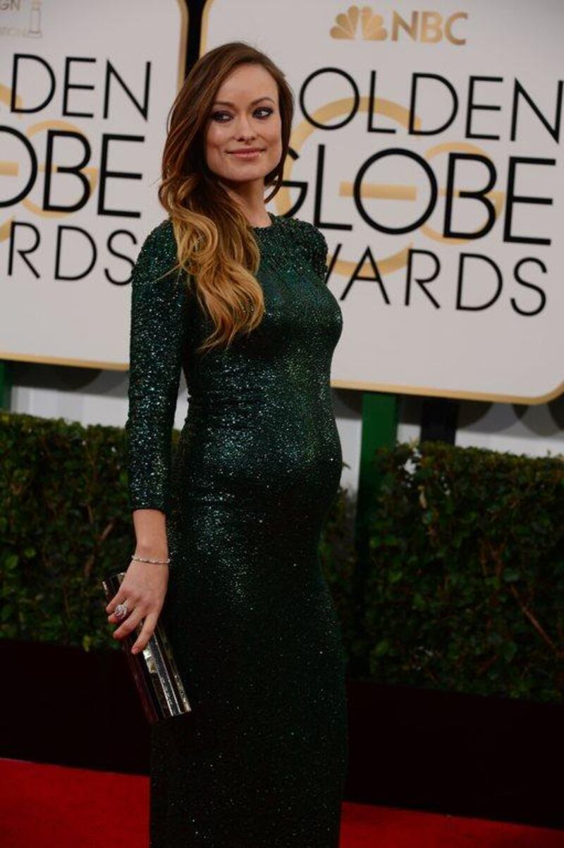 Actress Olivia Wilde arrives on the red carpet for the Golden Globe awards on January 12, 2014 in Beverly Hills, California.  AFP Photo/ Frederic J. Brown

