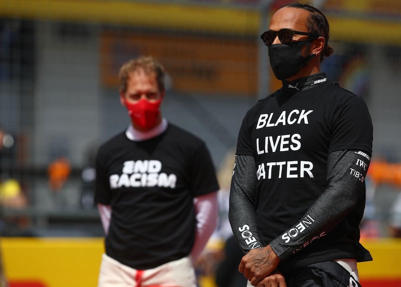 Sebastian Vettel and Lewis Hamilton take part in an anti-racism protest in support of the Black Lives Matter movement before the Styrian Grand Prix. AFP