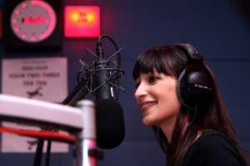 DUBAI - MAY 22,2009 -  Radio host Yara Obeidat on the booth  tackle about the world cultural diversity on her program aired in Salam radio at Dubai studio city. ( Paulo Vecina/The National ) *** Local Caption ***  PV Salam 4.jpg