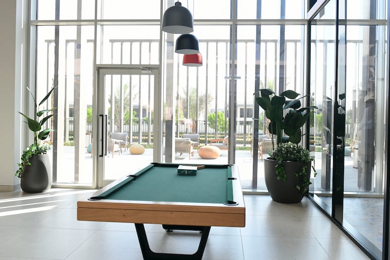 A pool table in the common area of the building