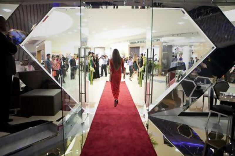 Models walk the red carpet at the official opening of the FTV cafe at Al Wahda Mall. Silvia Razgova / The National